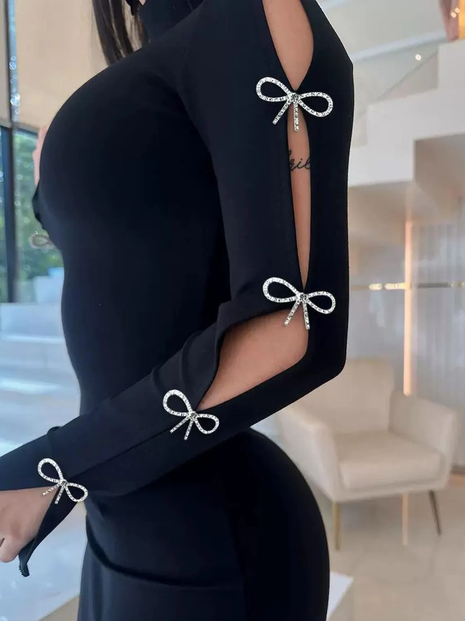 Sleek Black Bodycon Mini Dress With A High Neckline